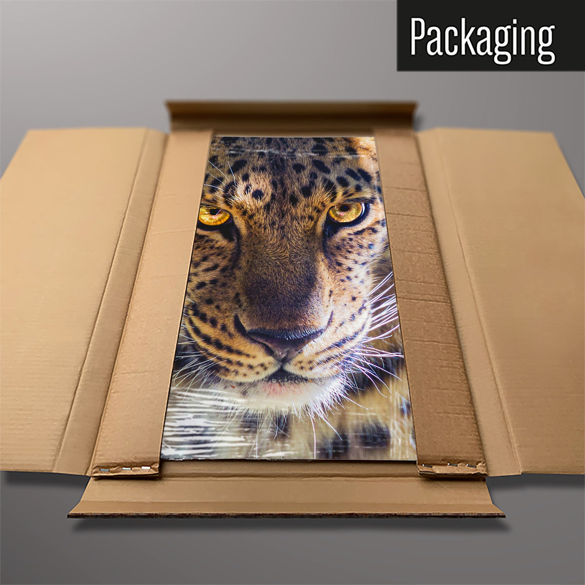 The Leopard Face magnetic notice board packed flat in its cardboard box