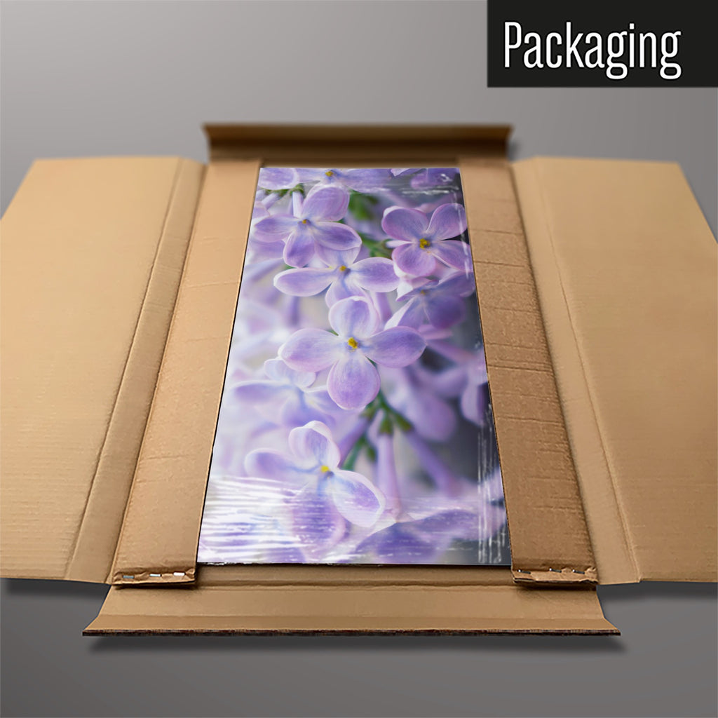 The Lilac magnetic notice board packed flat in its cardboard box