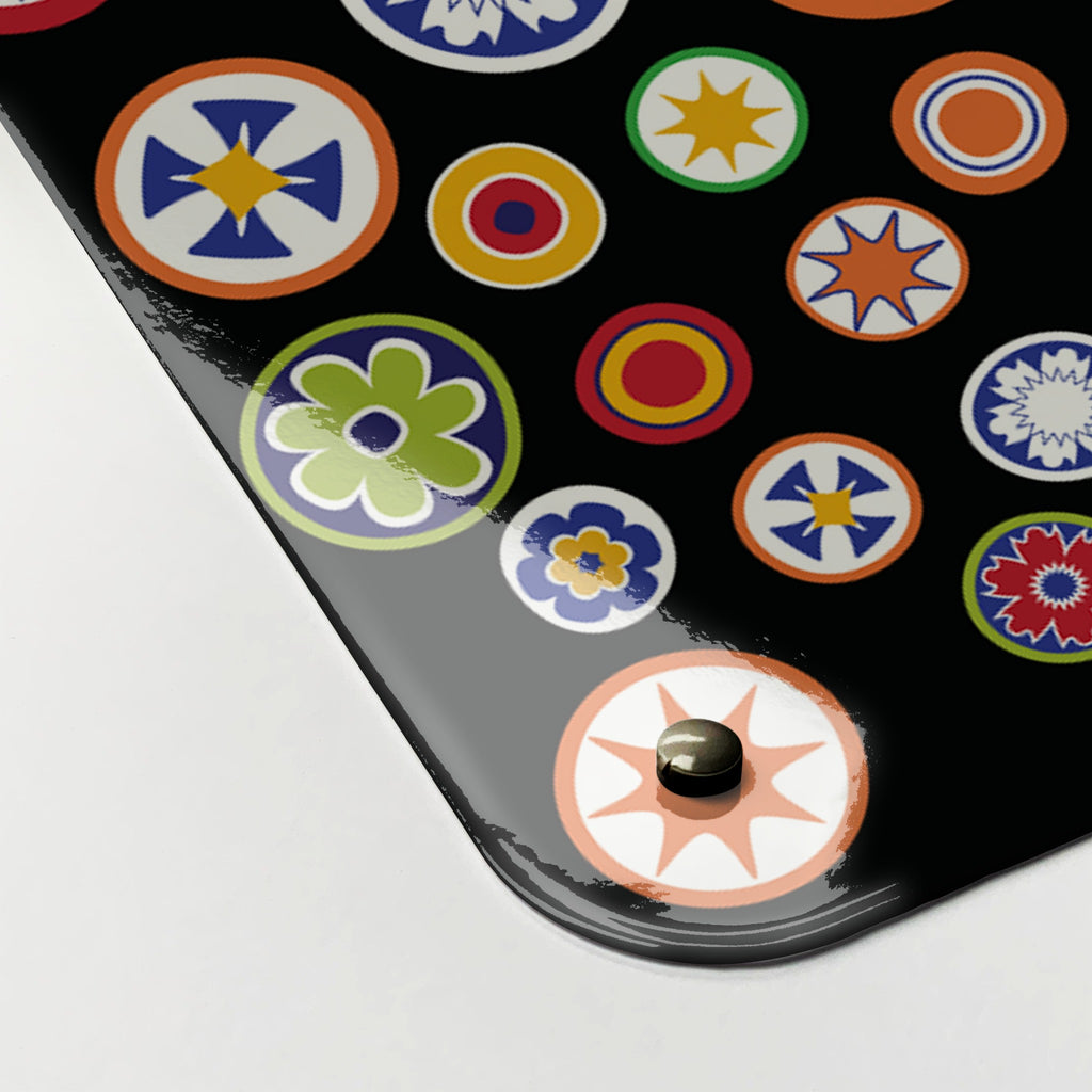 Close-up of the corner of the Millefiori magnetic notice board in Millefiori on Black, showing the gloss finish and a screw cap