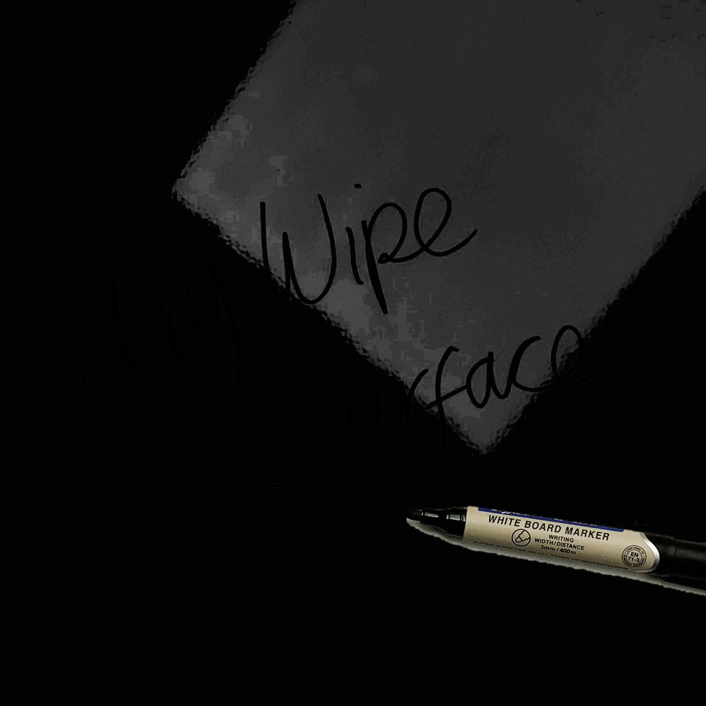 The words dry wipe surface written in marker pen on the Millefiori on Black Millefiori magnetic notice board