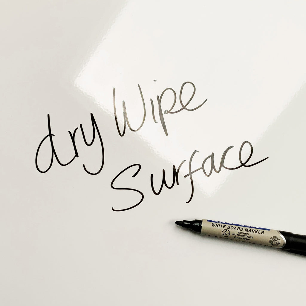The words dry wipe surface written in marker pen on the Monstera Plant magnetic notice board