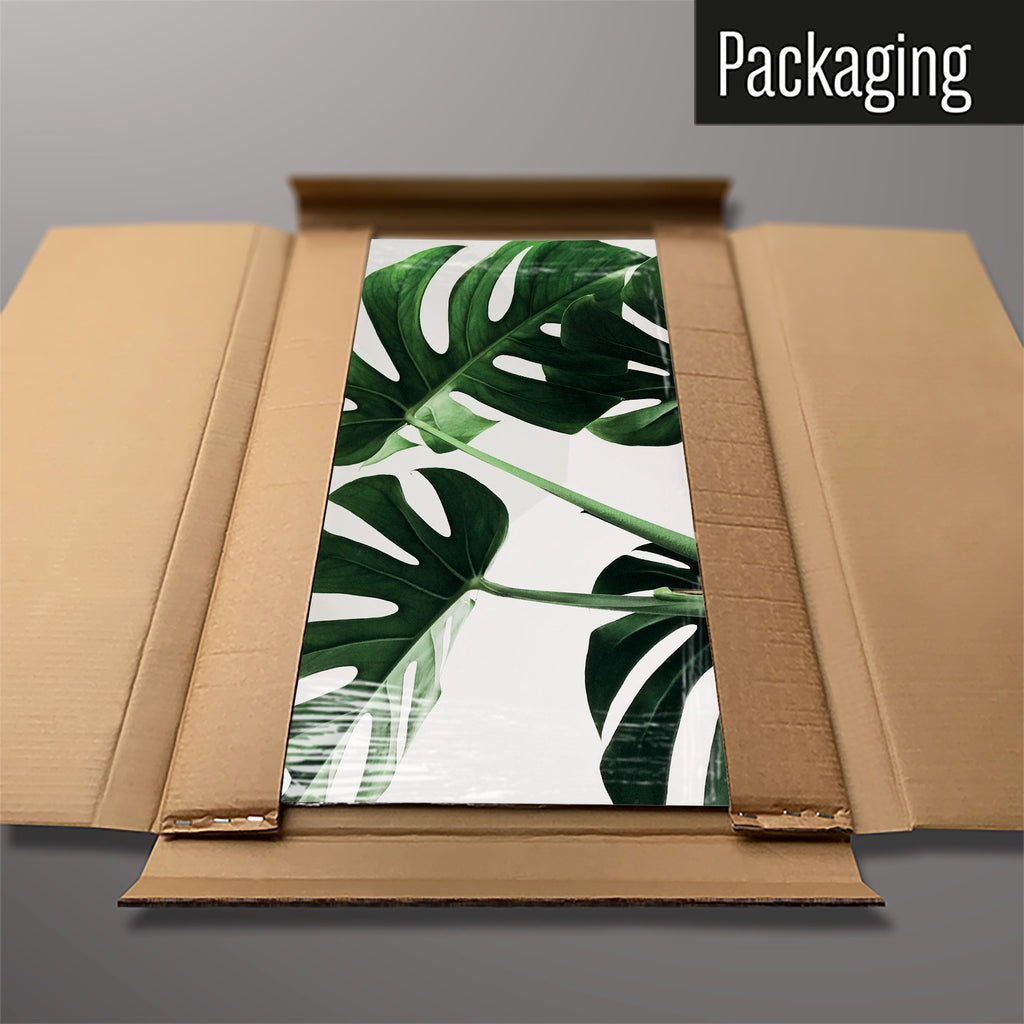 The Monstera Plant magnetic notice board packed flat in its cardboard box