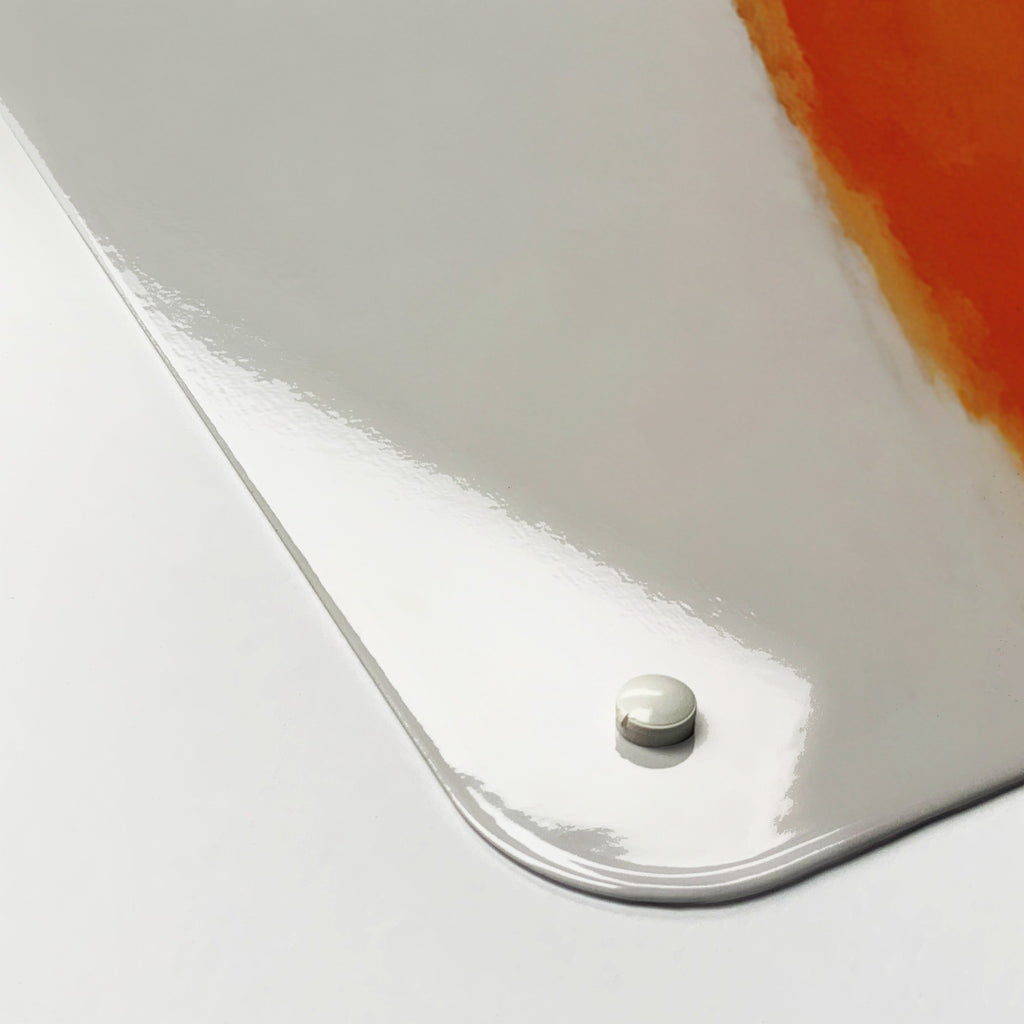 Close-up of the corner of the Mother Fox And Cub Watercolour magnetic notice board, showing the gloss finish and a screw cap