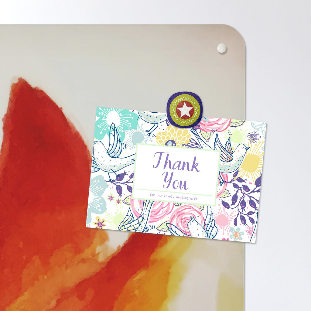 A postcard held by a fridge magnet on the Mother Fox And Cub Watercolour magnetic notice board