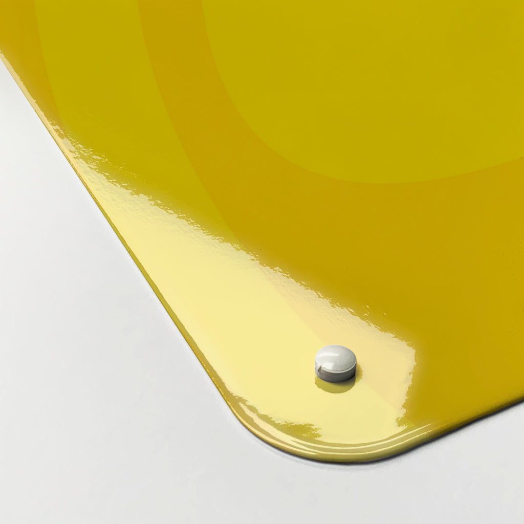 Close-up of the corner of the Oranges And Lemons magnetic notice board in Oranges and Lemons, showing the gloss finish and a screw cap