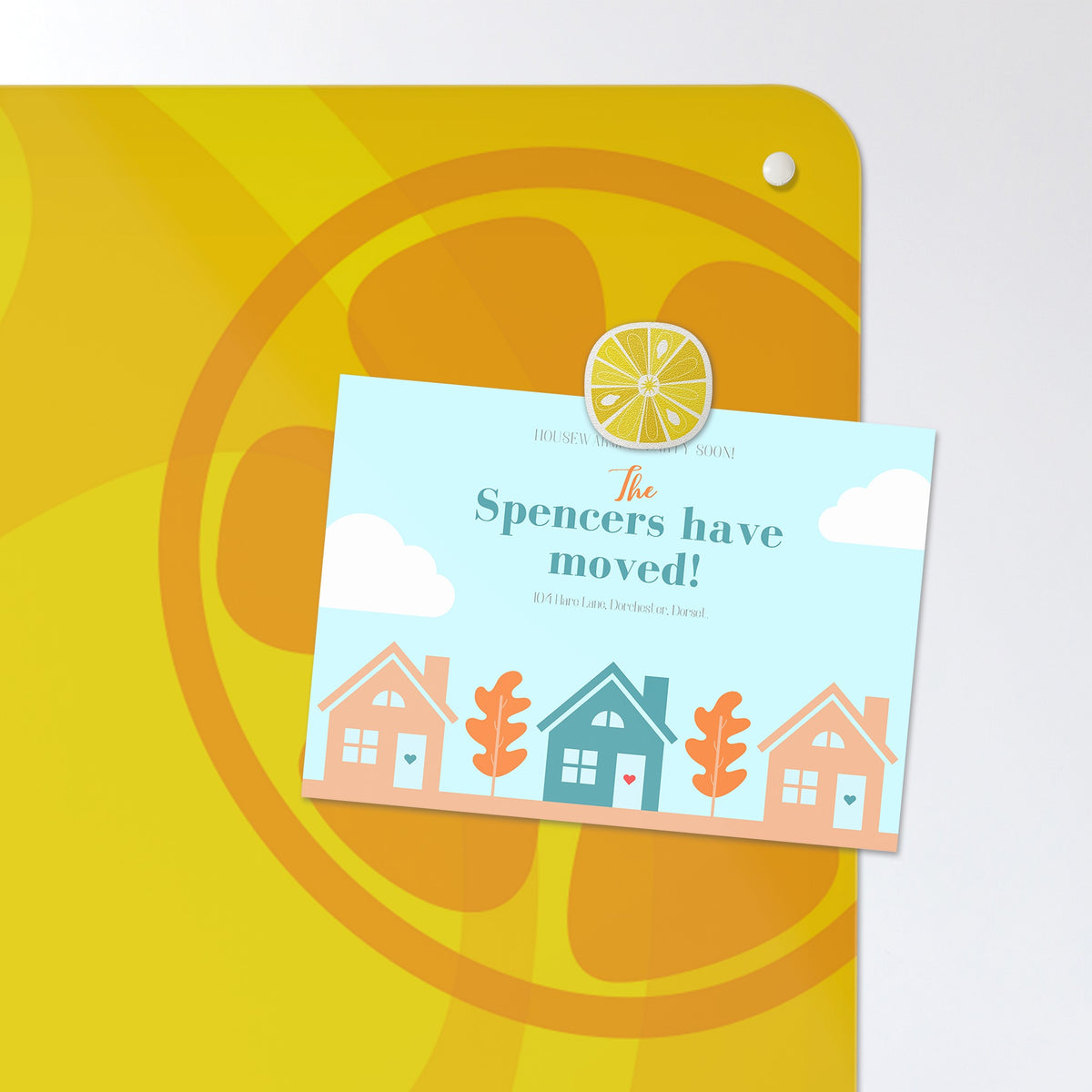 A postcard held by a fridge magnet on the Oranges And Lemons magnetic notice board in Oranges and Lemons