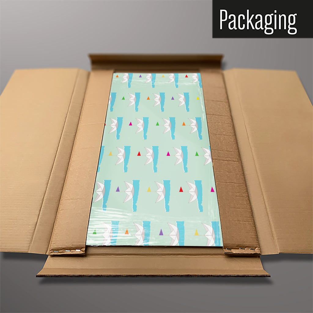 The Paper Boats magnetic notice board in Paper Boats packed flat in its cardboard box