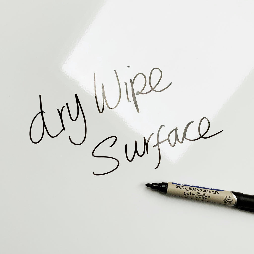 The words dry wipe surface written in marker pen on the Paper Clips Paper Clips magnetic notice board