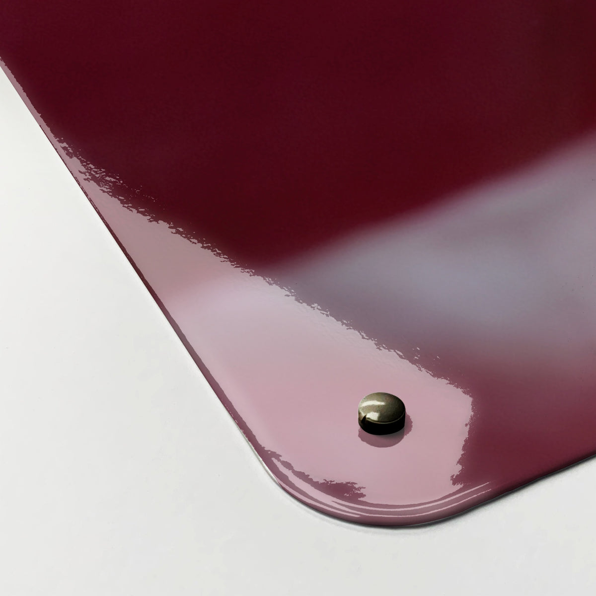 Close-up of the corner of the Pink Rose magnetic notice board in Pink Rose, showing the gloss finish and a screw cap