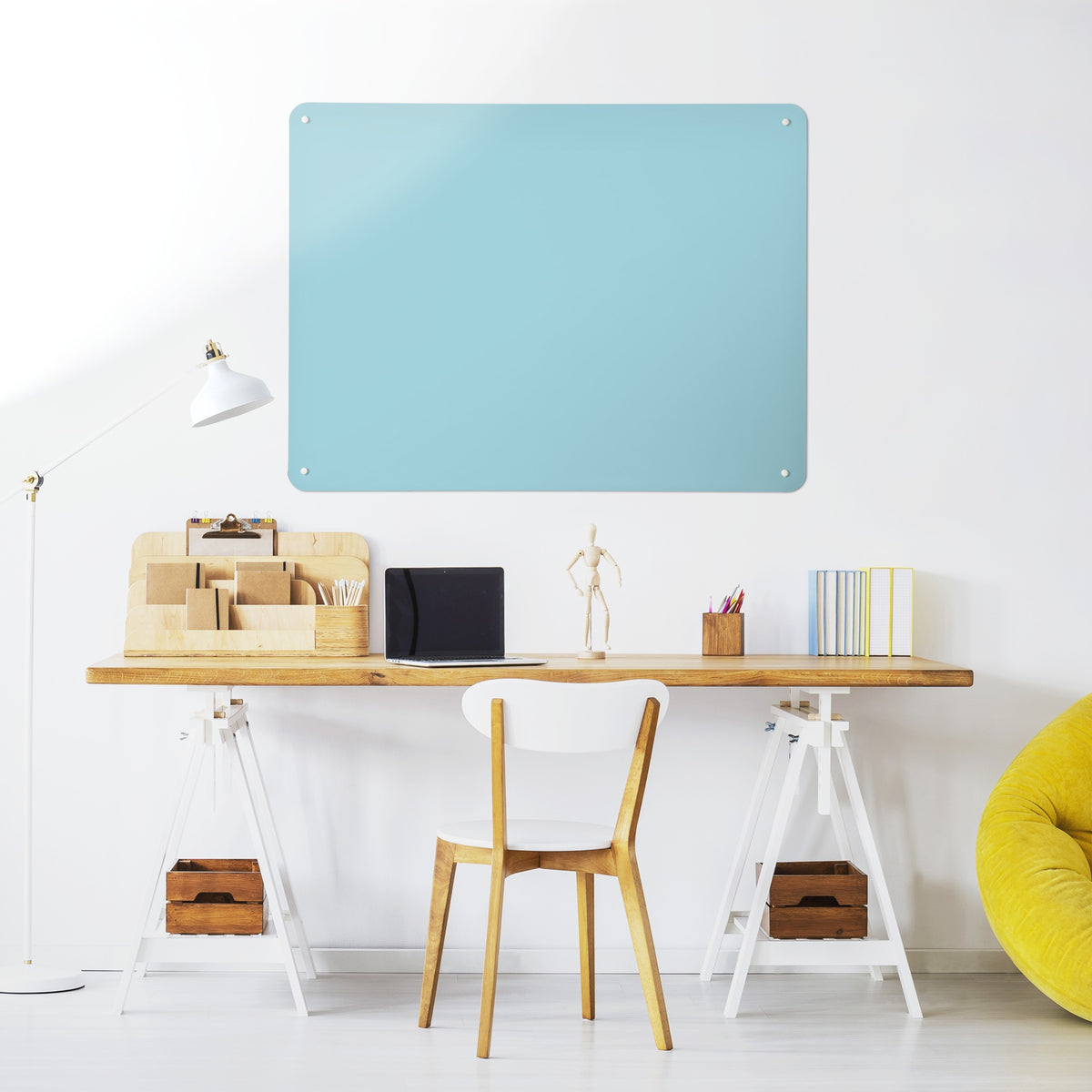Plain Blue magnetic notice board above a desk in a home office
