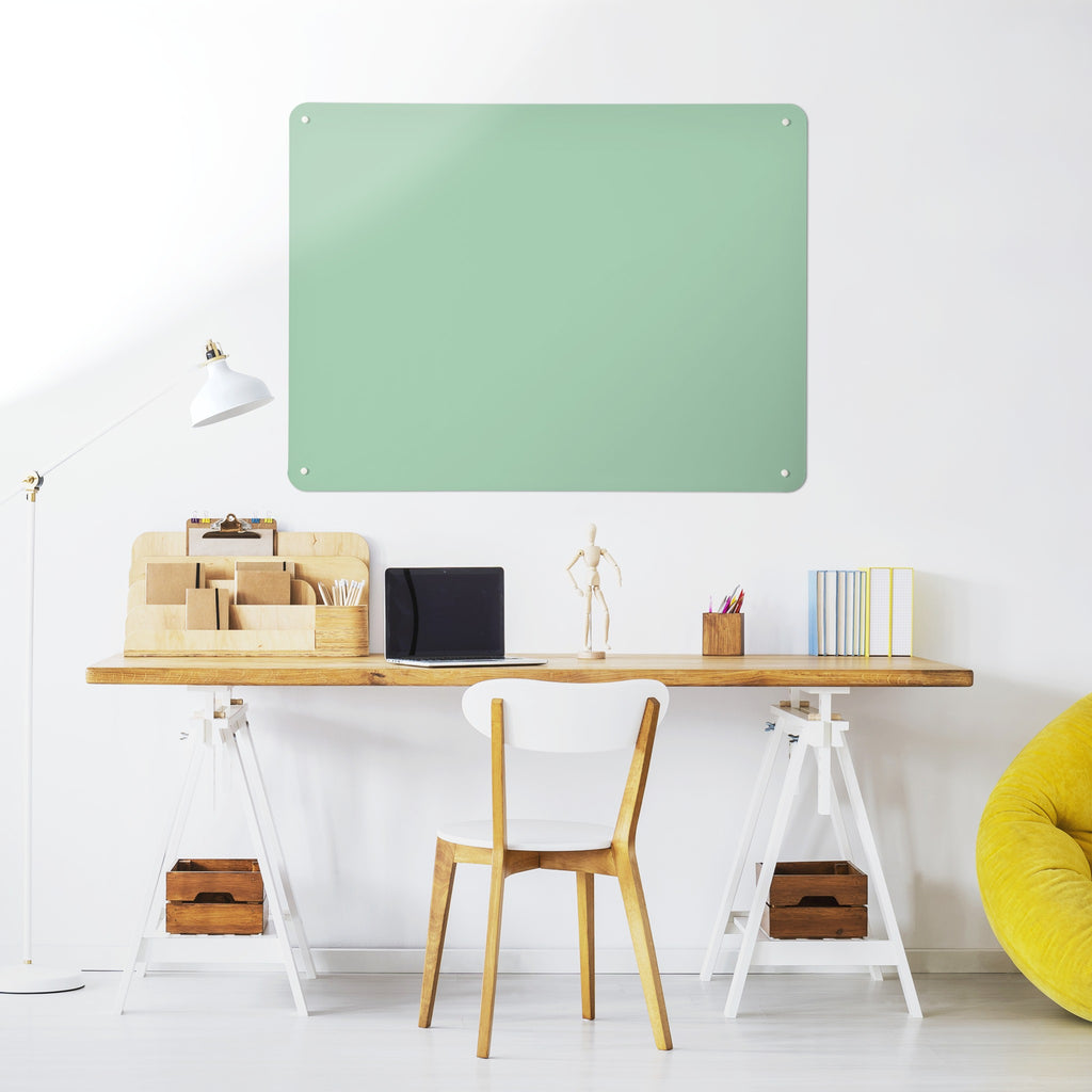 Plain Green magnetic notice board above a desk in a home office