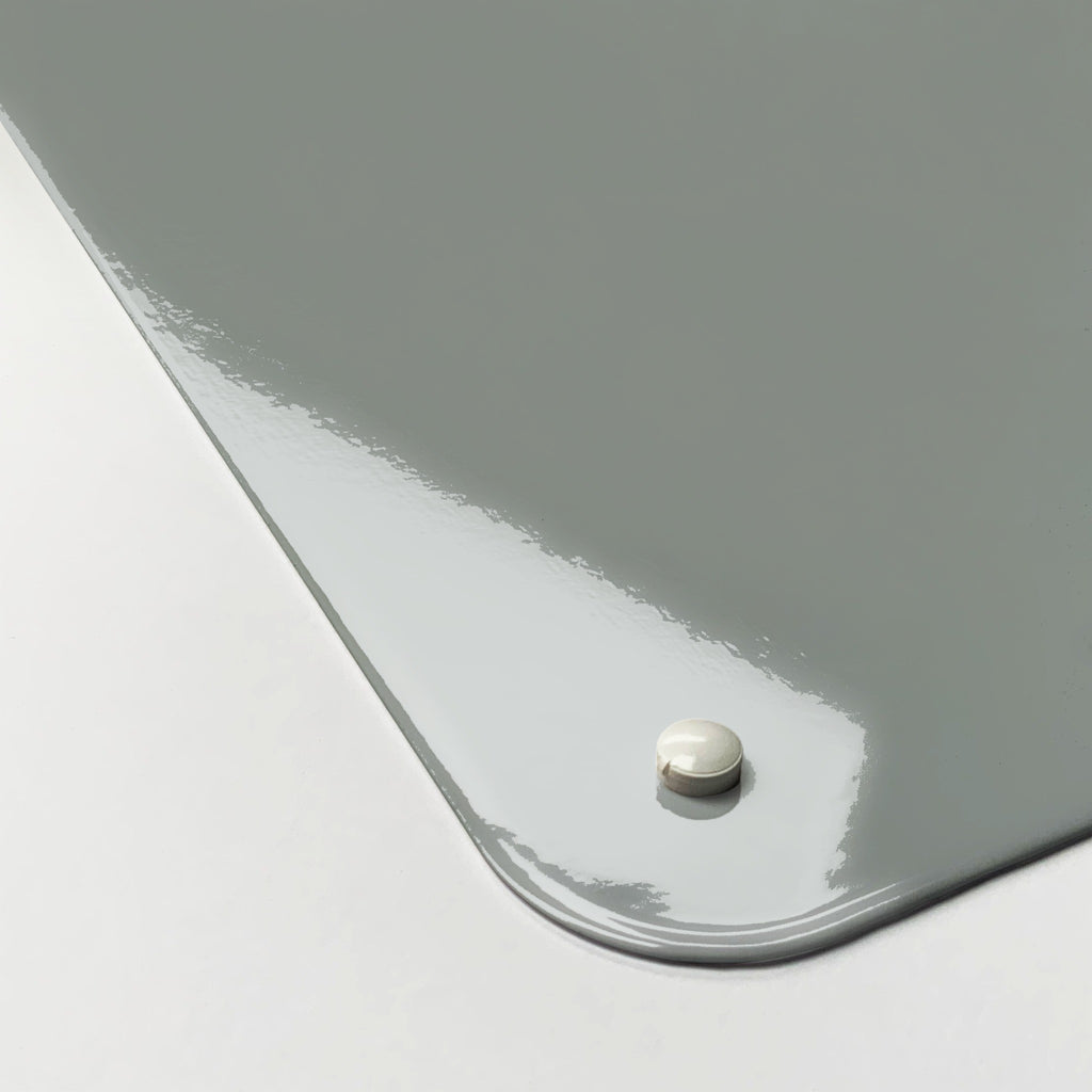 Close-up of the corner of the Plain Grey magnetic notice board, showing the gloss finish and a screw cap