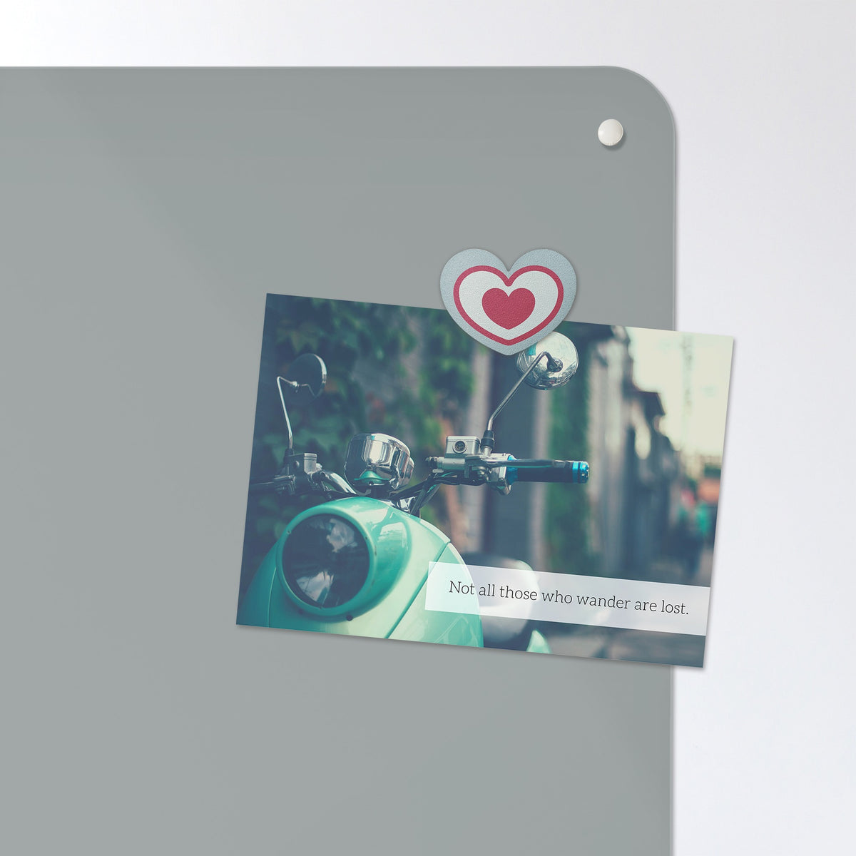 A postcard held by a fridge magnet on the Plain Grey magnetic notice board