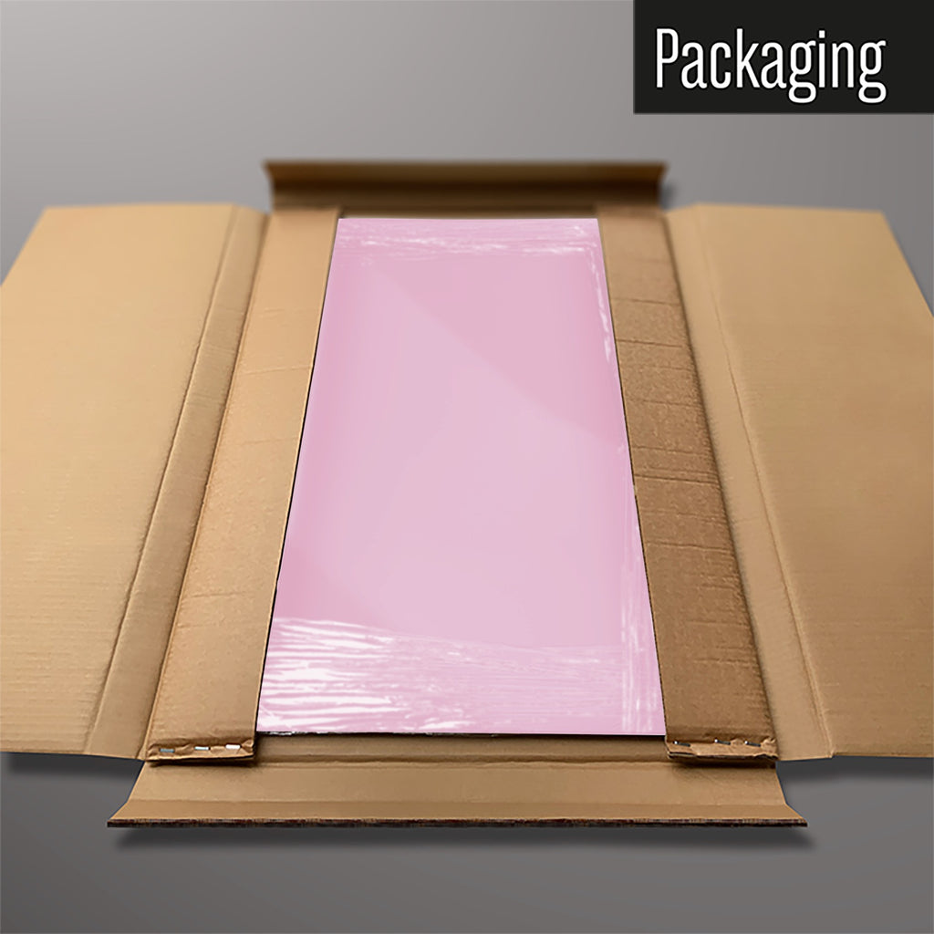 The Plain Pink magnetic notice board packed flat in its cardboard box