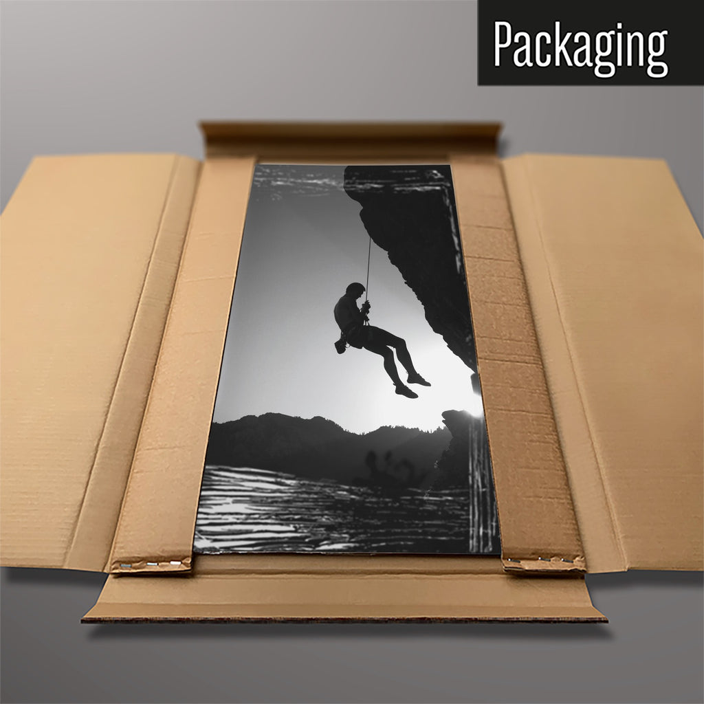 The Rock Climbing magnetic notice board packed flat in its cardboard box