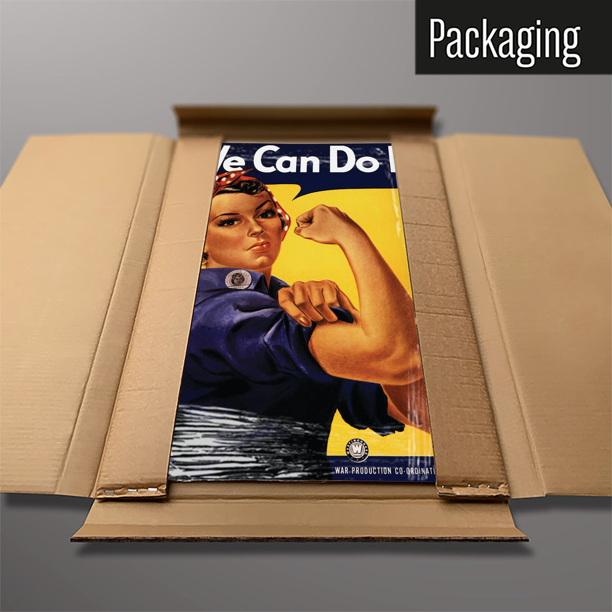 The Rosie The Riveter magnetic notice board packed flat in its cardboard box