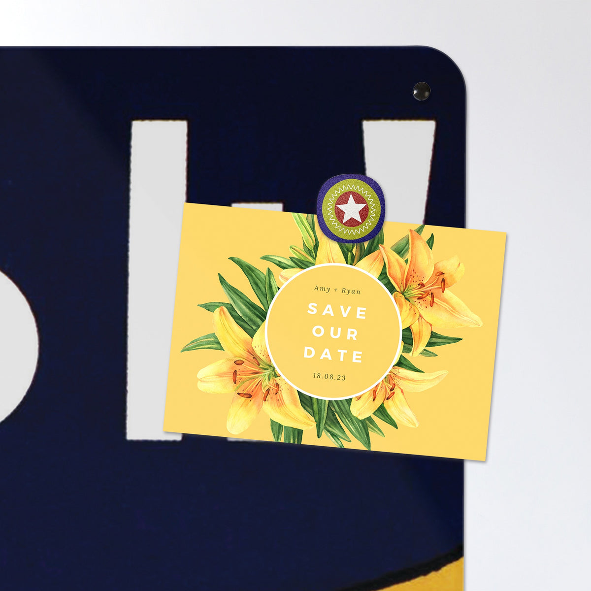 A postcard held by a fridge magnet on the Rosie The Riveter magnetic notice board
