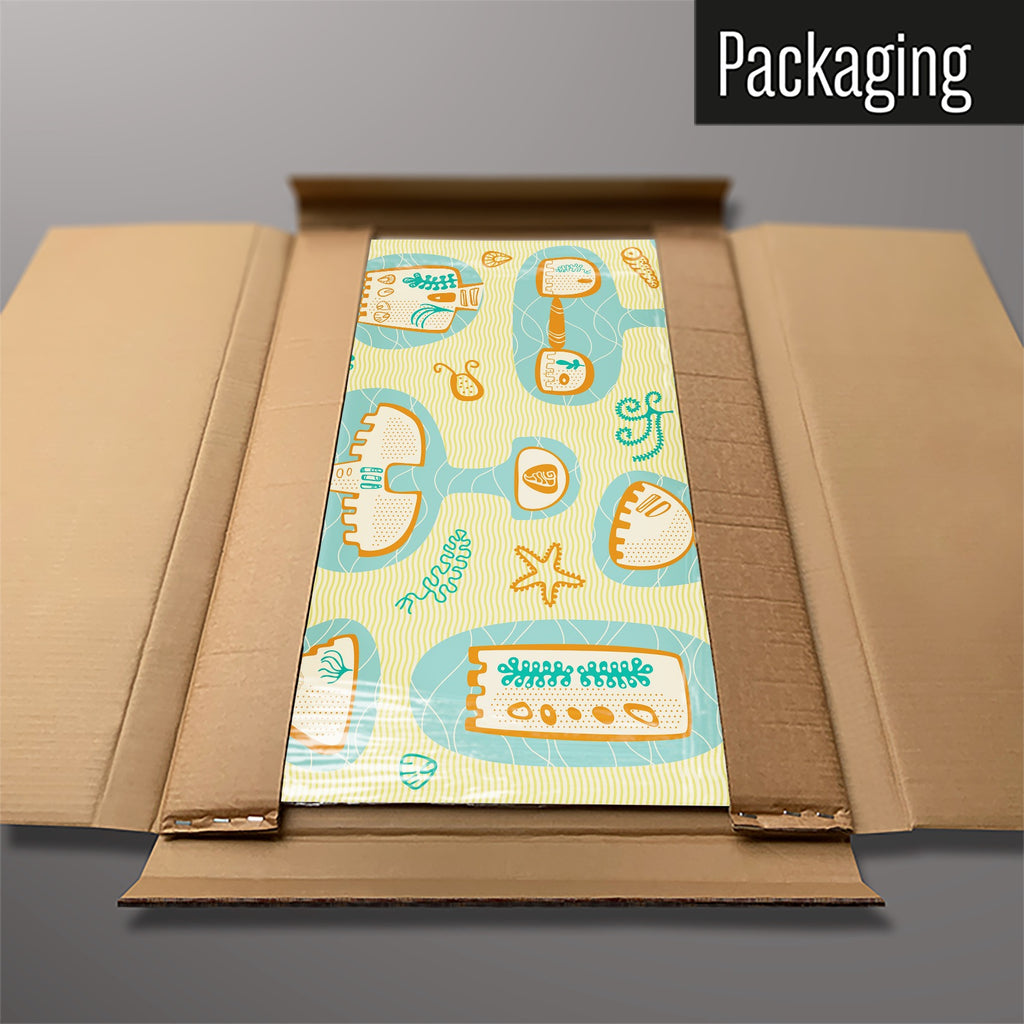 The Sandcastles magnetic notice board packed flat in its cardboard box