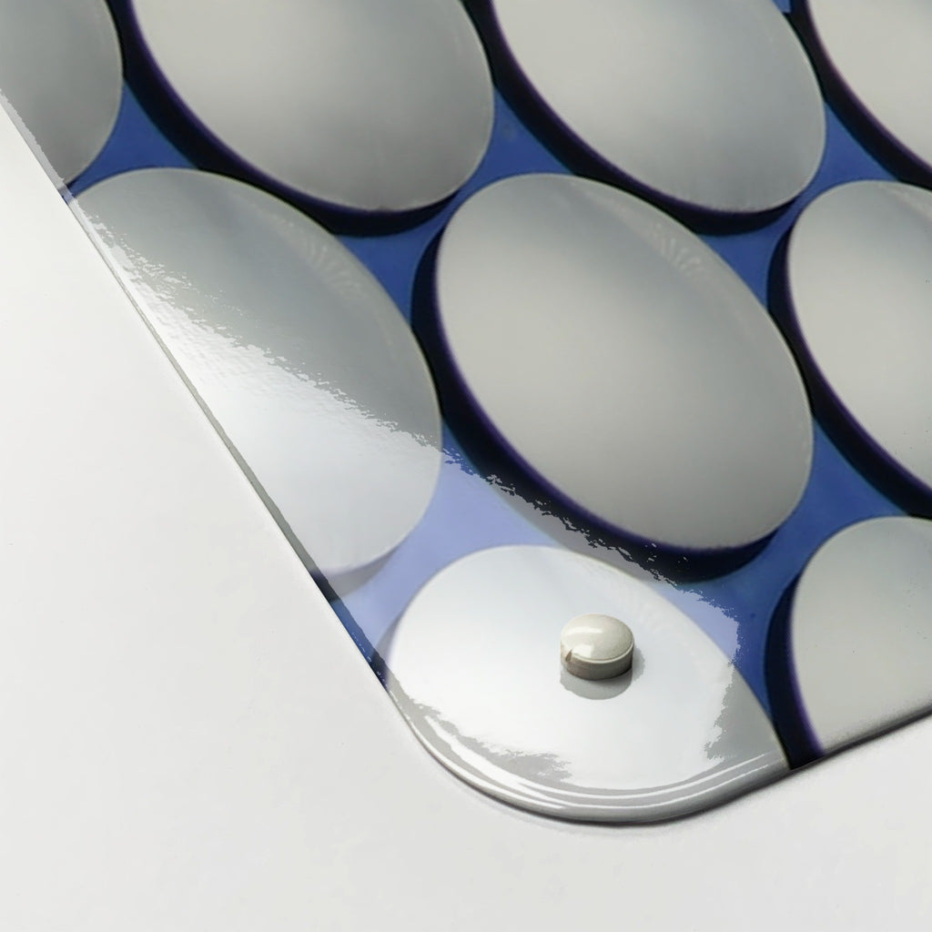 Close-up of the corner of the Selfridges Building Birmingham magnetic notice board, showing the gloss finish and a screw cap