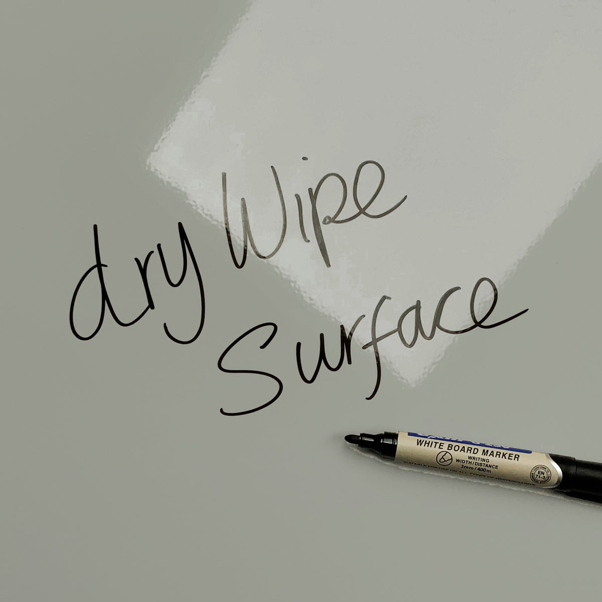 The words dry wipe surface written in marker pen on the Concrete and Yellow Shards Design magnetic notice board