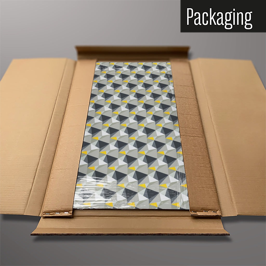 The Shards Design magnetic notice board in Concrete and Yellow packed flat in its cardboard box