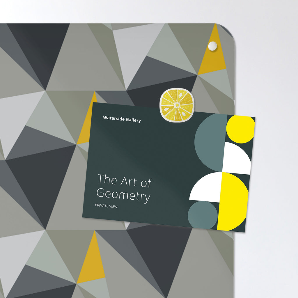 A postcard held by a fridge magnet on the Shards Design magnetic notice board in Concrete and Yellow