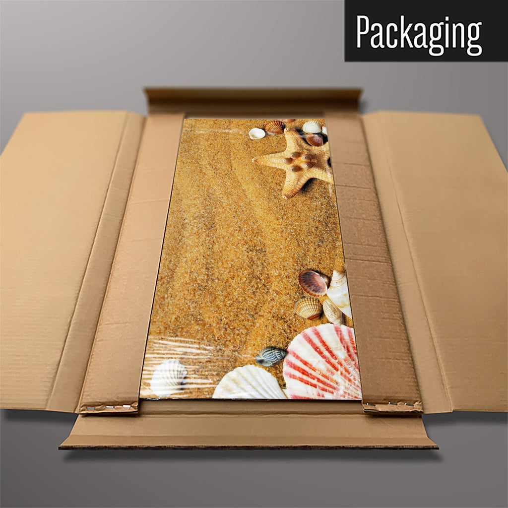 The Shoreline Shells magnetic notice board packed flat in its cardboard box