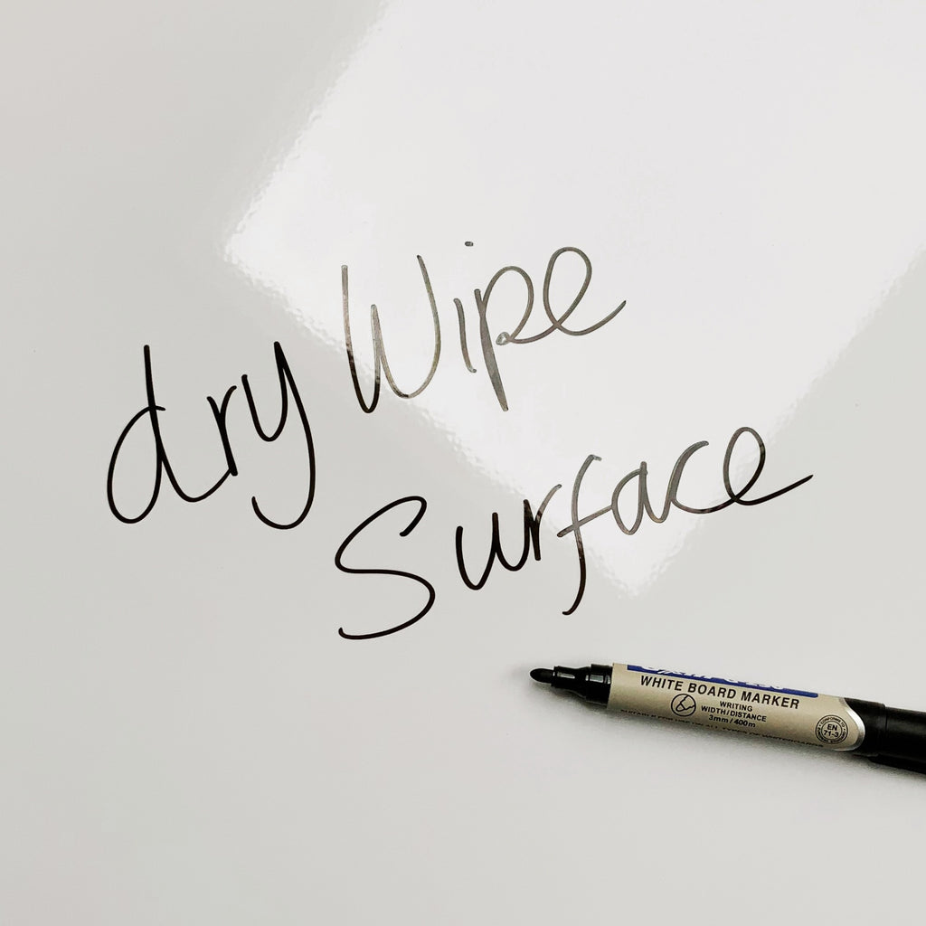 The words dry wipe surface written in marker pen on the Snowboarding magnetic notice board