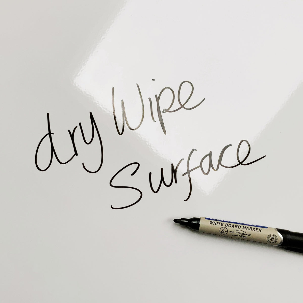The words dry wipe surface written in marker pen on the Snowboarding magnetic notice board