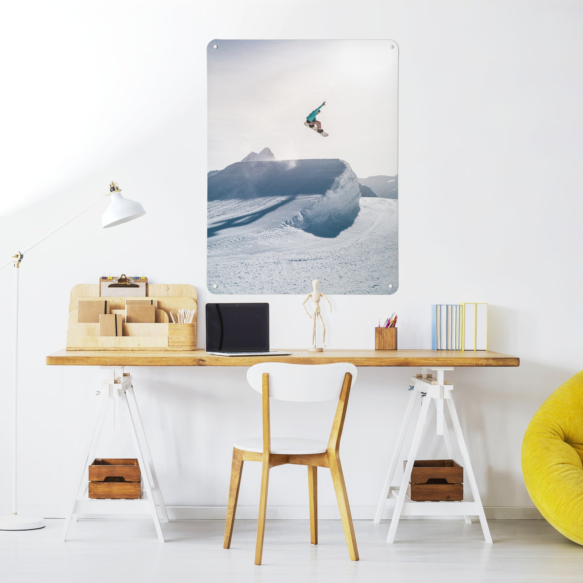 Snowboarding magnetic notice board above a desk in a home office