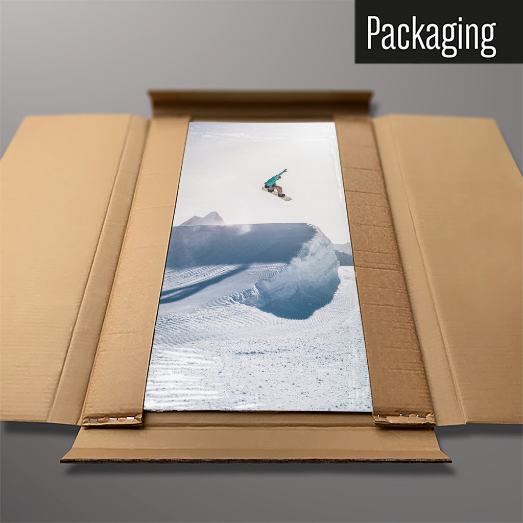 The Snowboarding magnetic notice board packed flat in its cardboard box