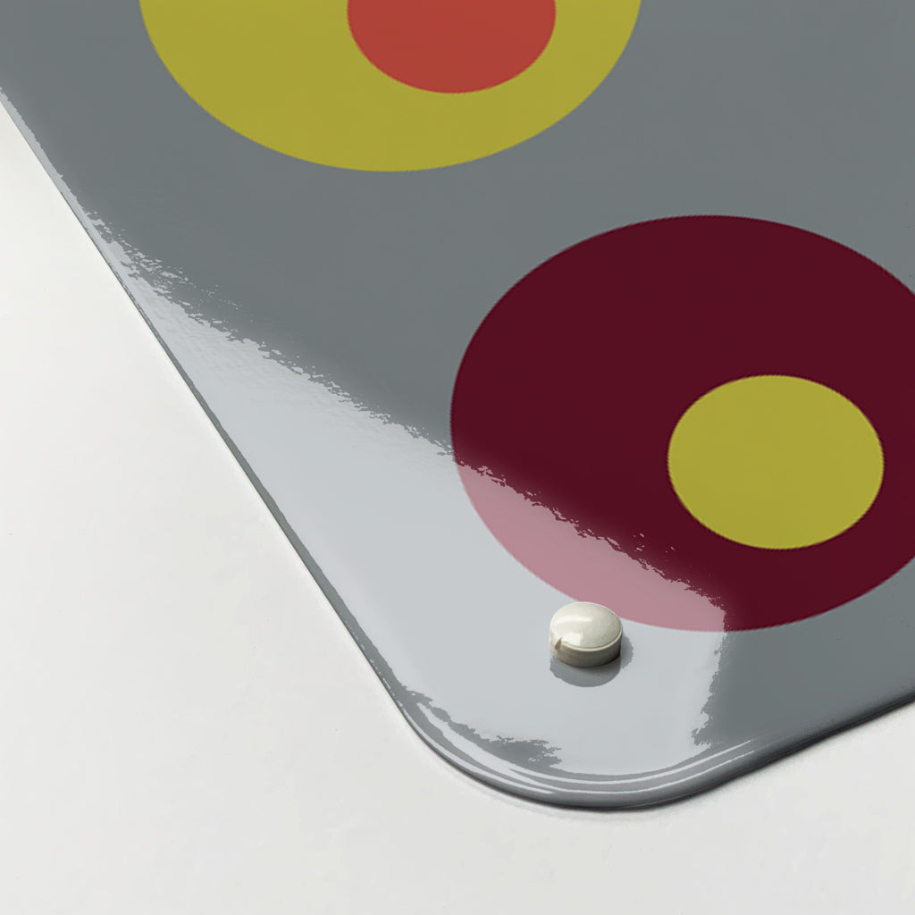 Close-up of the corner of the Spots magnetic notice board in Spots on Grey, showing the gloss finish and a screw cap