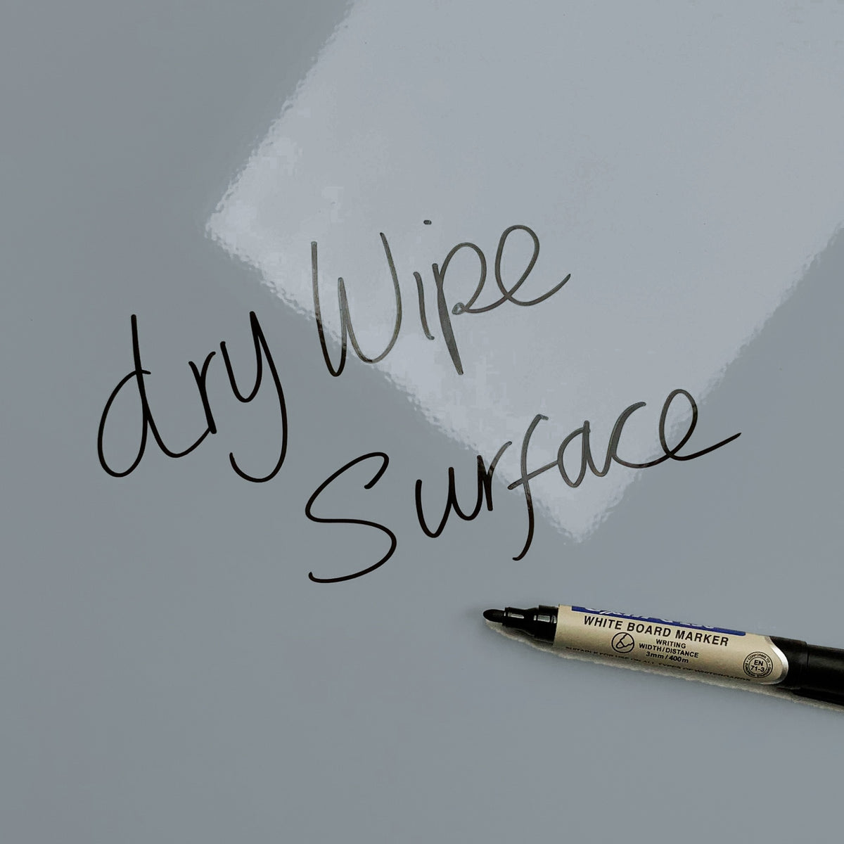 The words dry wipe surface written in marker pen on the Spots on Grey Spots magnetic notice board