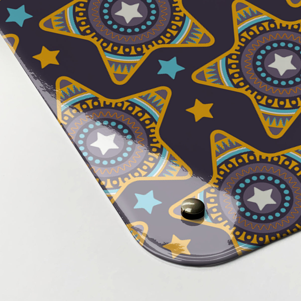 Close-up of the corner of the Stars magnetic notice board in purple, showing the gloss finish and a screw cap
