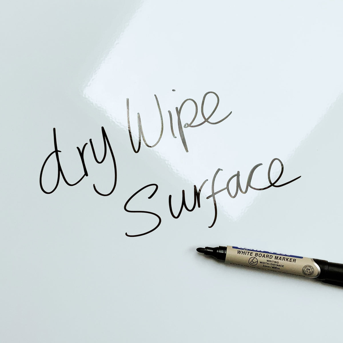 The words dry wipe surface written in marker pen on the Statue Of Liberty magnetic notice board