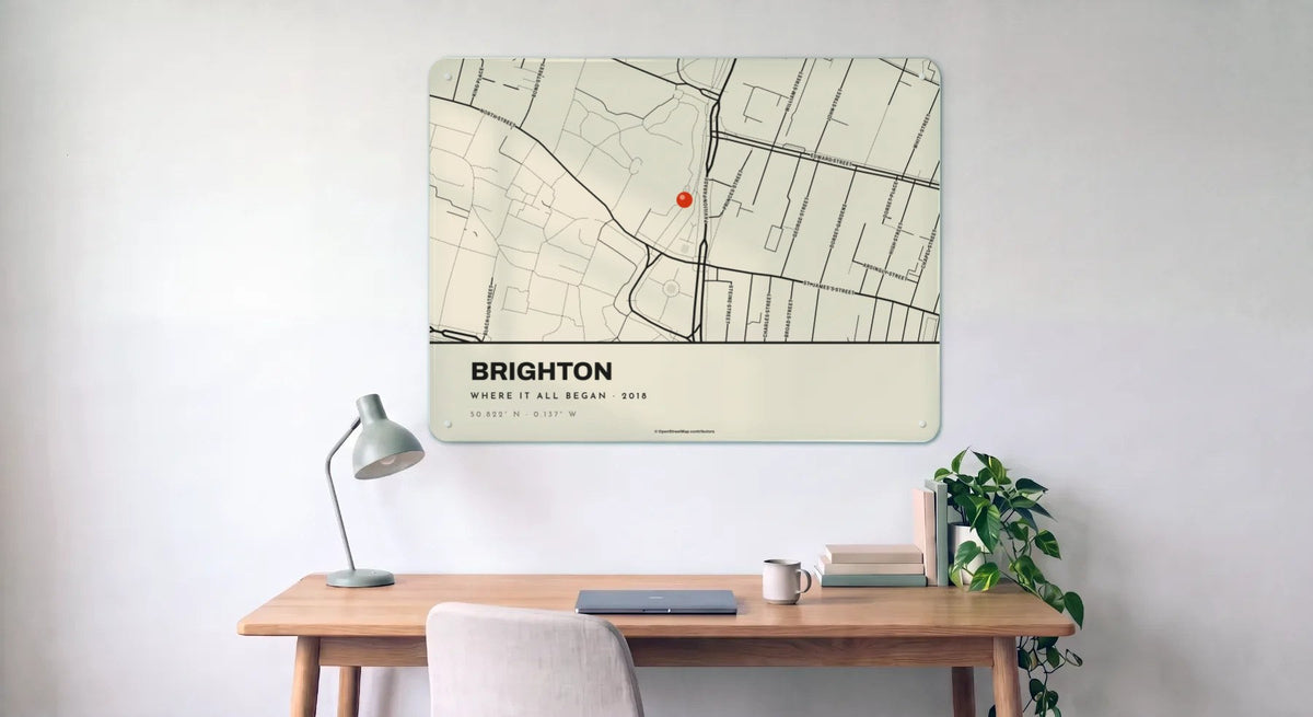 A Classic street map board of Brighton, with street names, above a desk