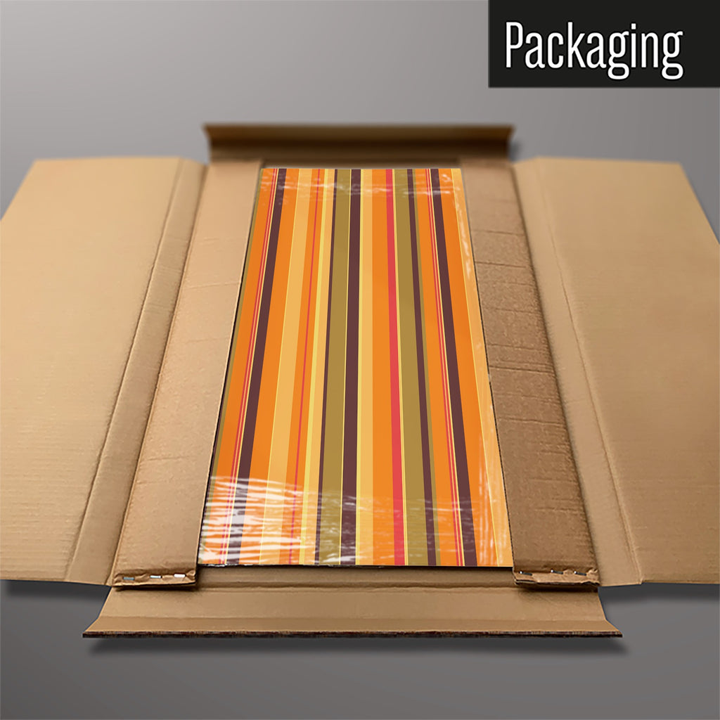 The Stripes magnetic notice board in Stripes - Pumpkin packed flat in its cardboard box