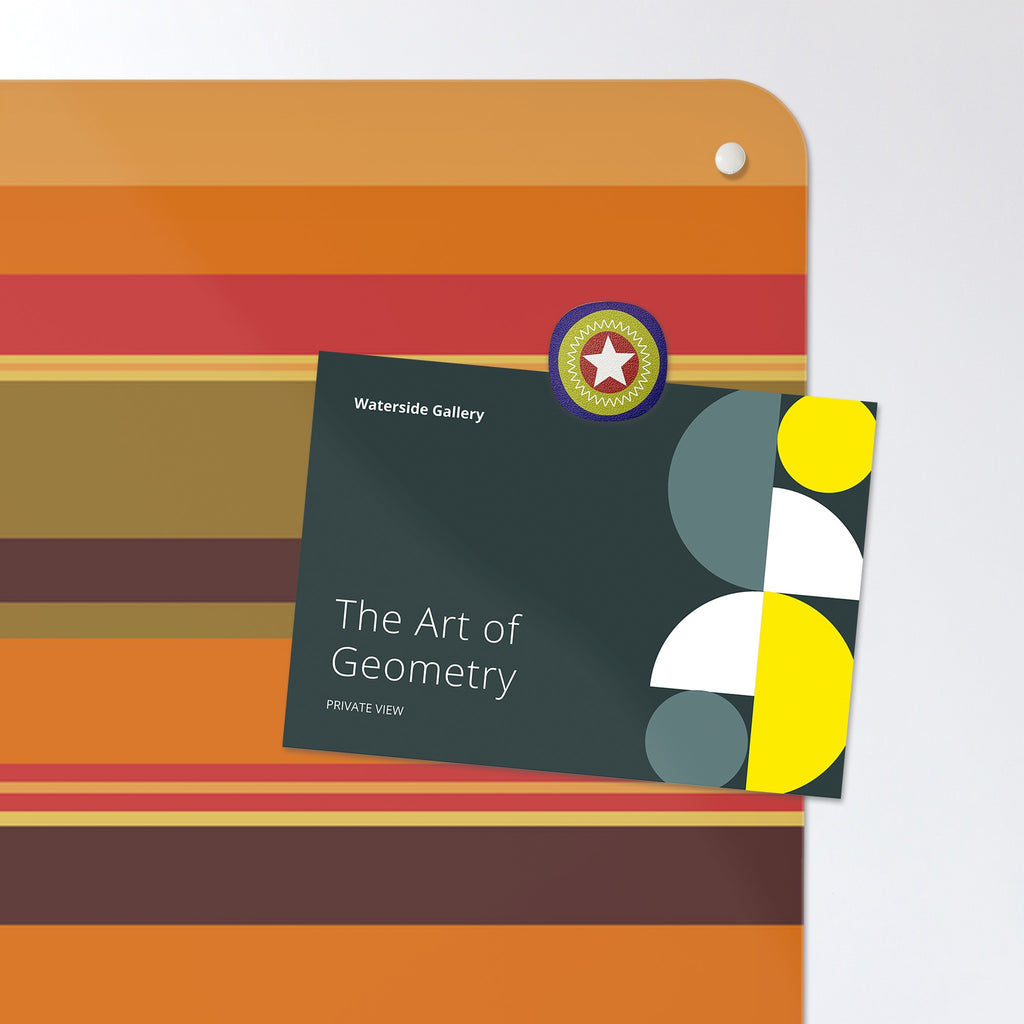 A postcard held by a fridge magnet on the Stripes magnetic notice board in Stripes - Pumpkin