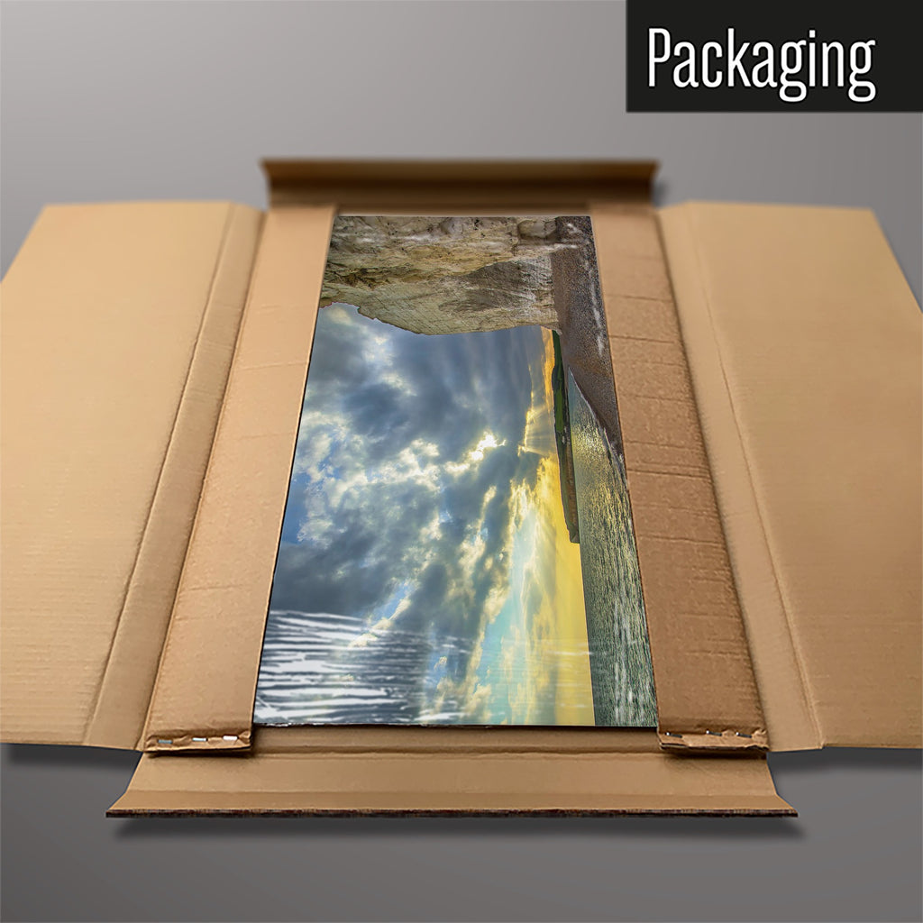 The Sussex Coast Sunset magnetic notice board packed flat in its cardboard box