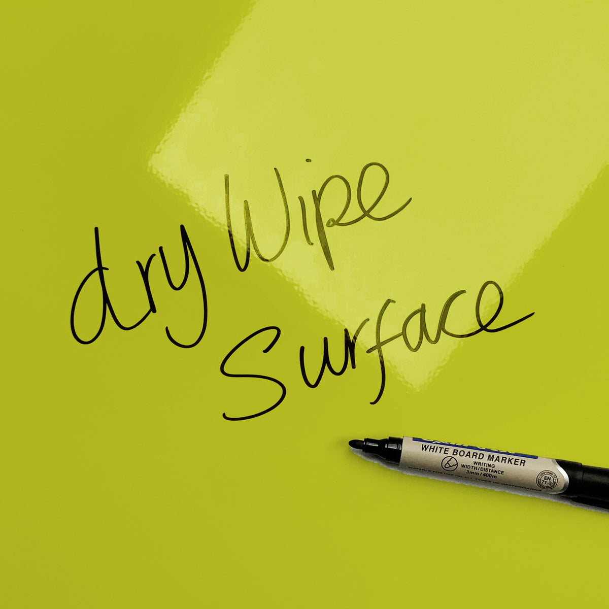 The words dry wipe surface written in marker pen on the Green Ten Bottles magnetic notice board
