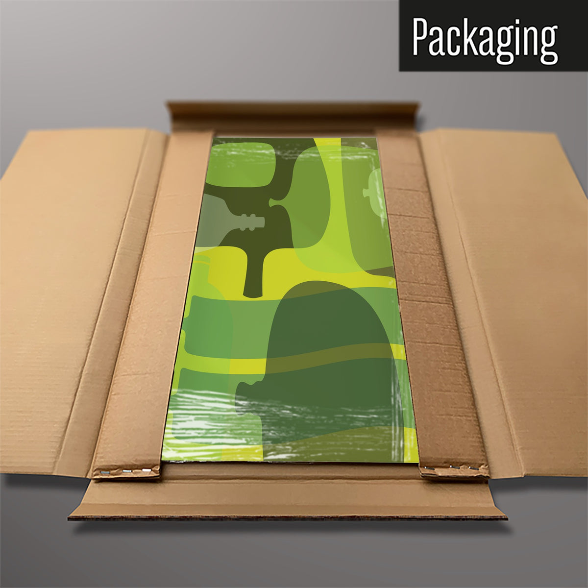 The Ten Bottles magnetic notice board in Green packed flat in its cardboard box