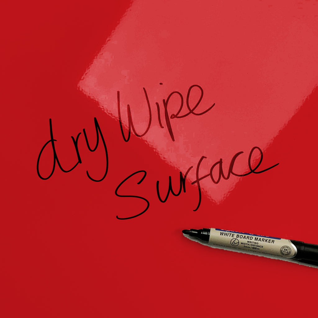 The words dry wipe surface written in marker pen on the red Utensils magnetic notice board