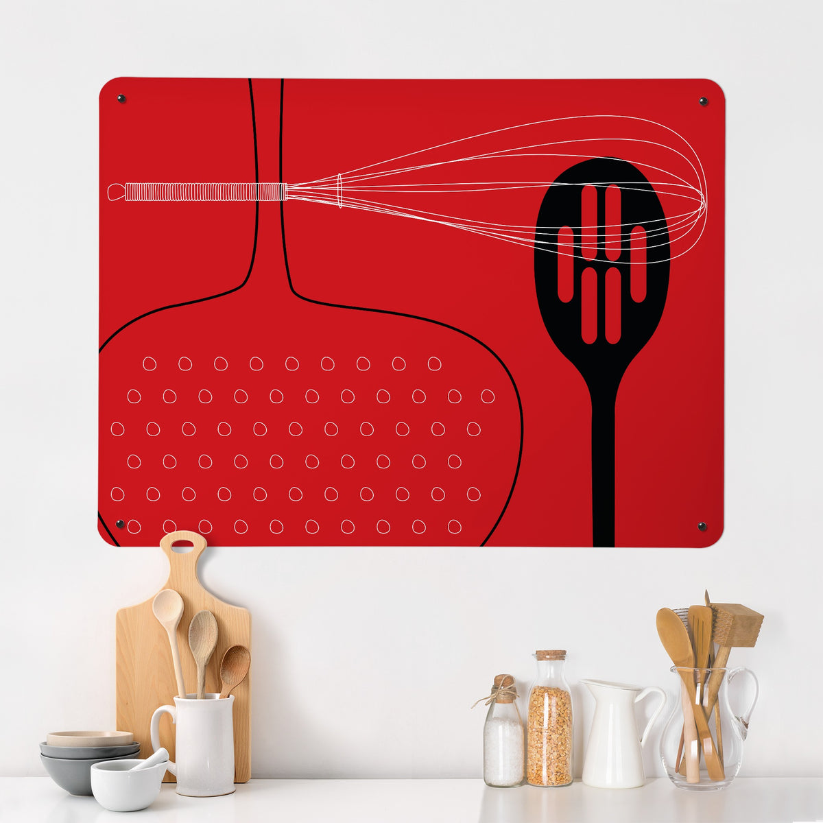 Utensils magnetic notice board in red on a kitchen wall