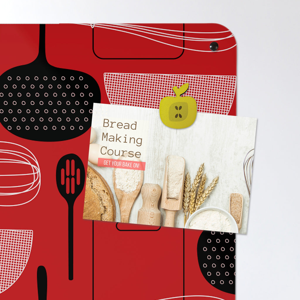 A postcard held by a fridge magnet on the Utensils Repeat Pattern magnetic notice board in Red