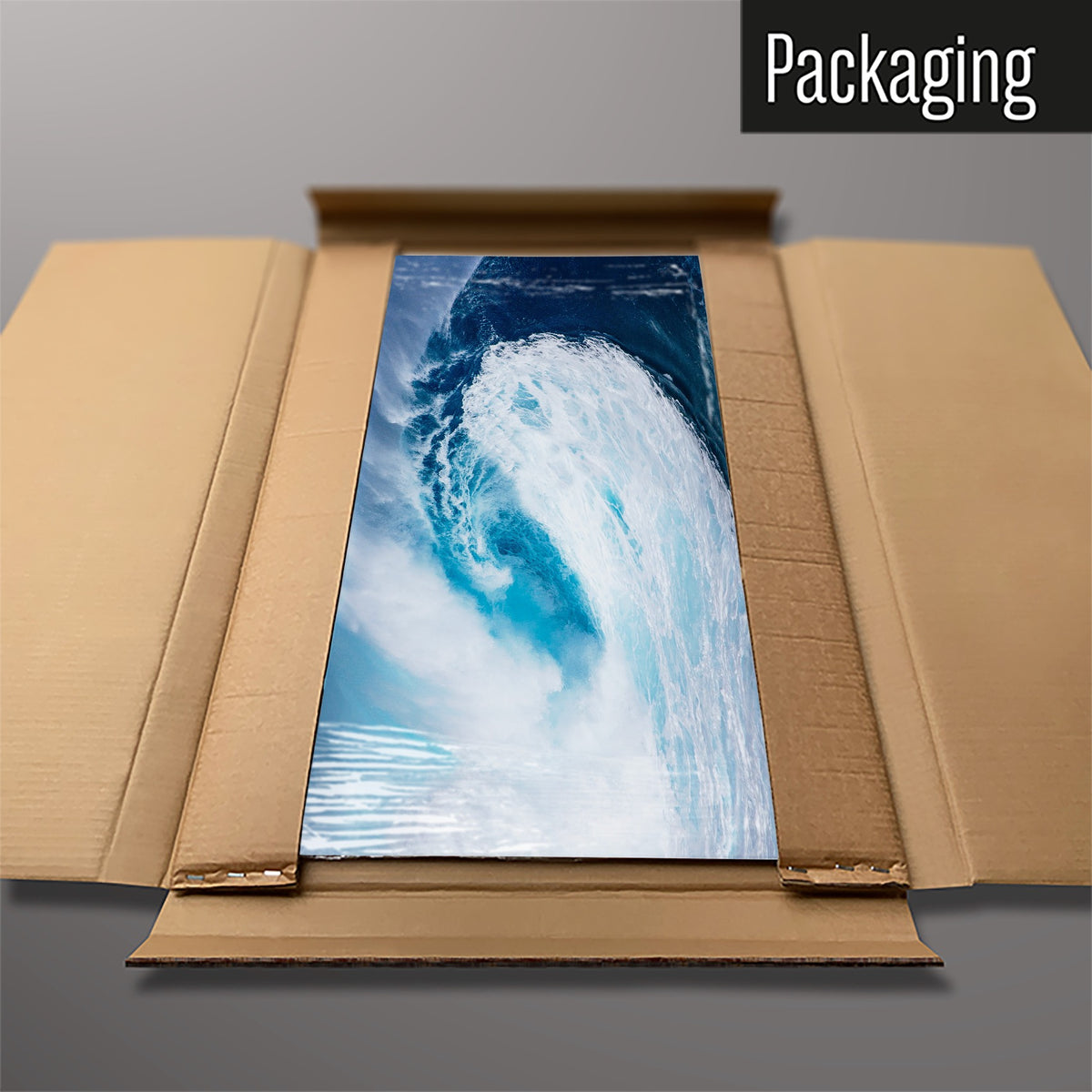 The Wave magnetic notice board packed flat in its cardboard box
