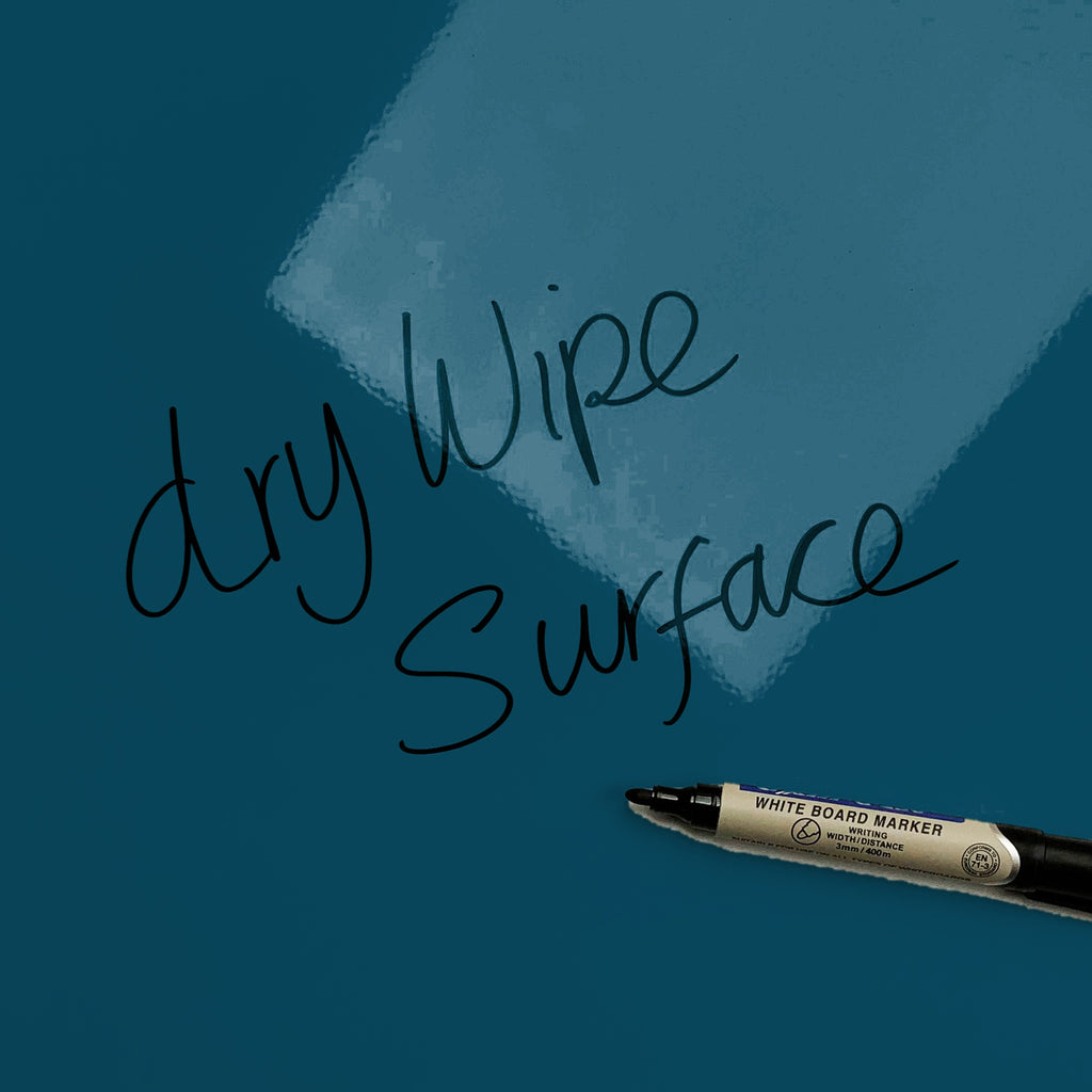 The words dry wipe surface written in marker pen on the Waves On The Shore magnetic notice board