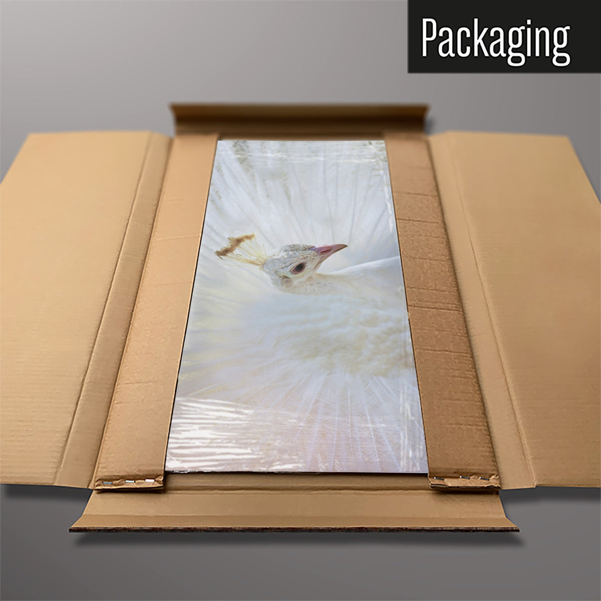 The White Peacock magnetic notice board packed flat in its cardboard box