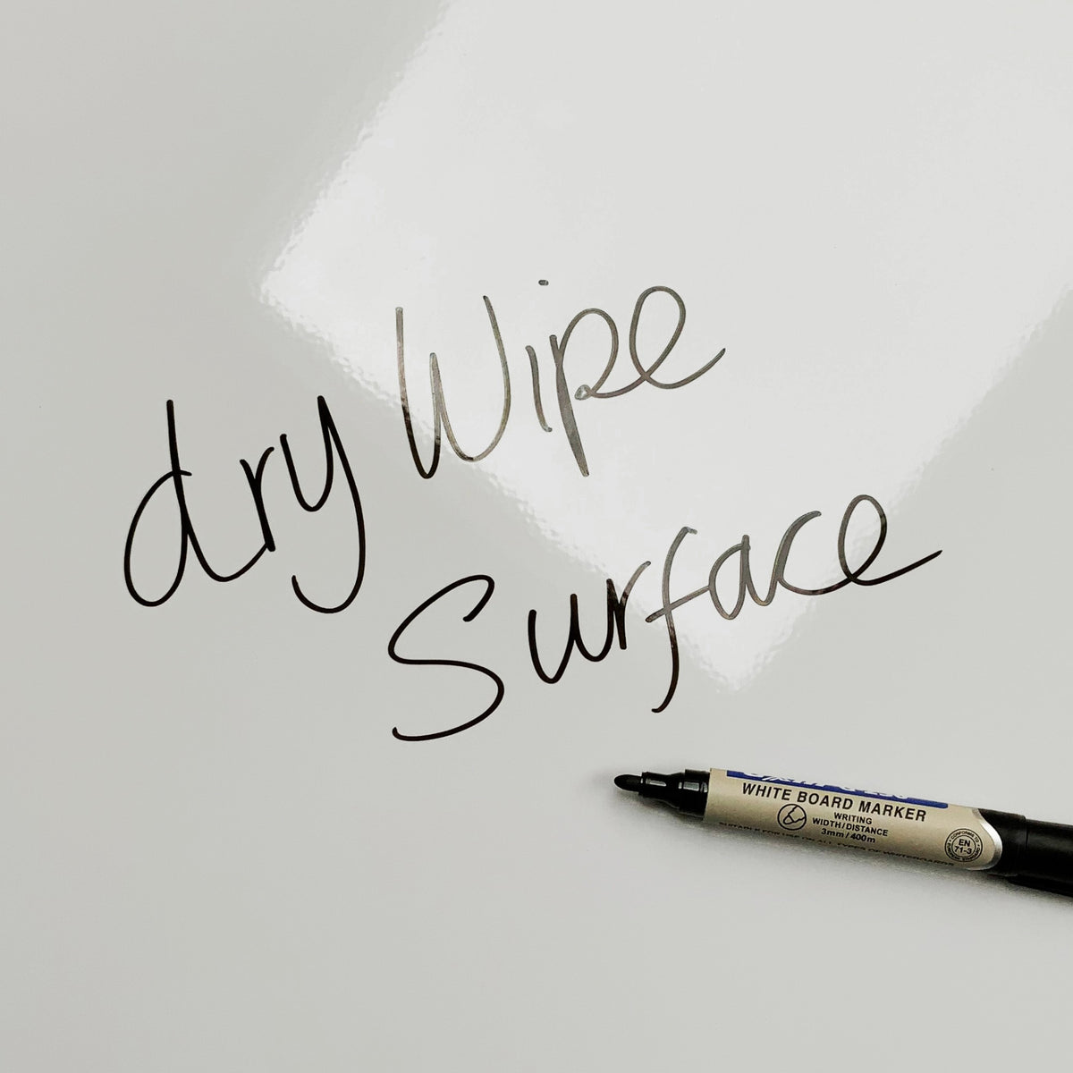 The words dry wipe surface written in marker pen on the Window Pattern magnetic notice board