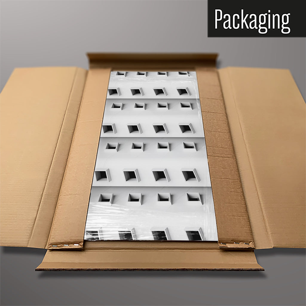 The Window Pattern magnetic notice board packed flat in its cardboard box