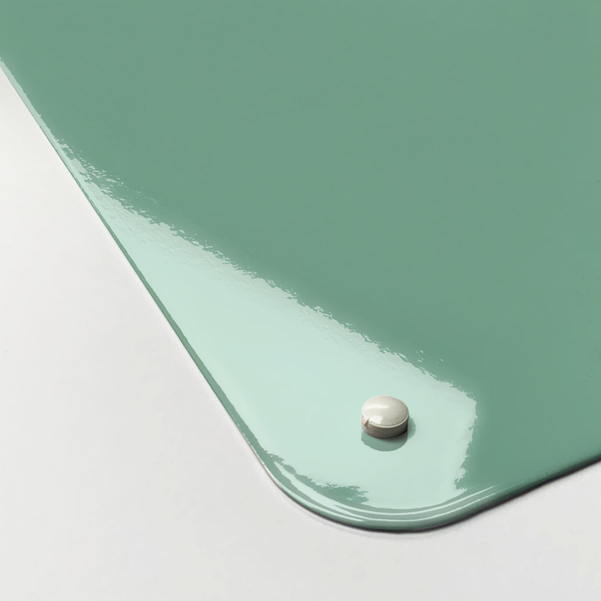 Close-up of the corner of the Wise Owl Number Square magnetic notice board in Wise Owl Number Square, showing the gloss finish and a screw cap